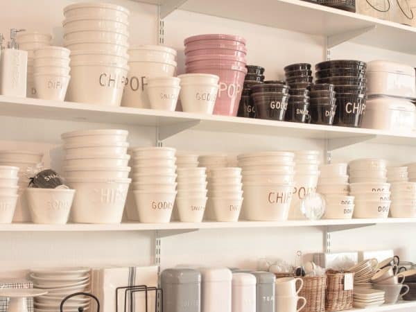 white plastic cups on white wooden shelf